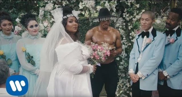 From the ‘Truth Hurts’ music video: Lizzo in a wedding gown stands at a wedding altar